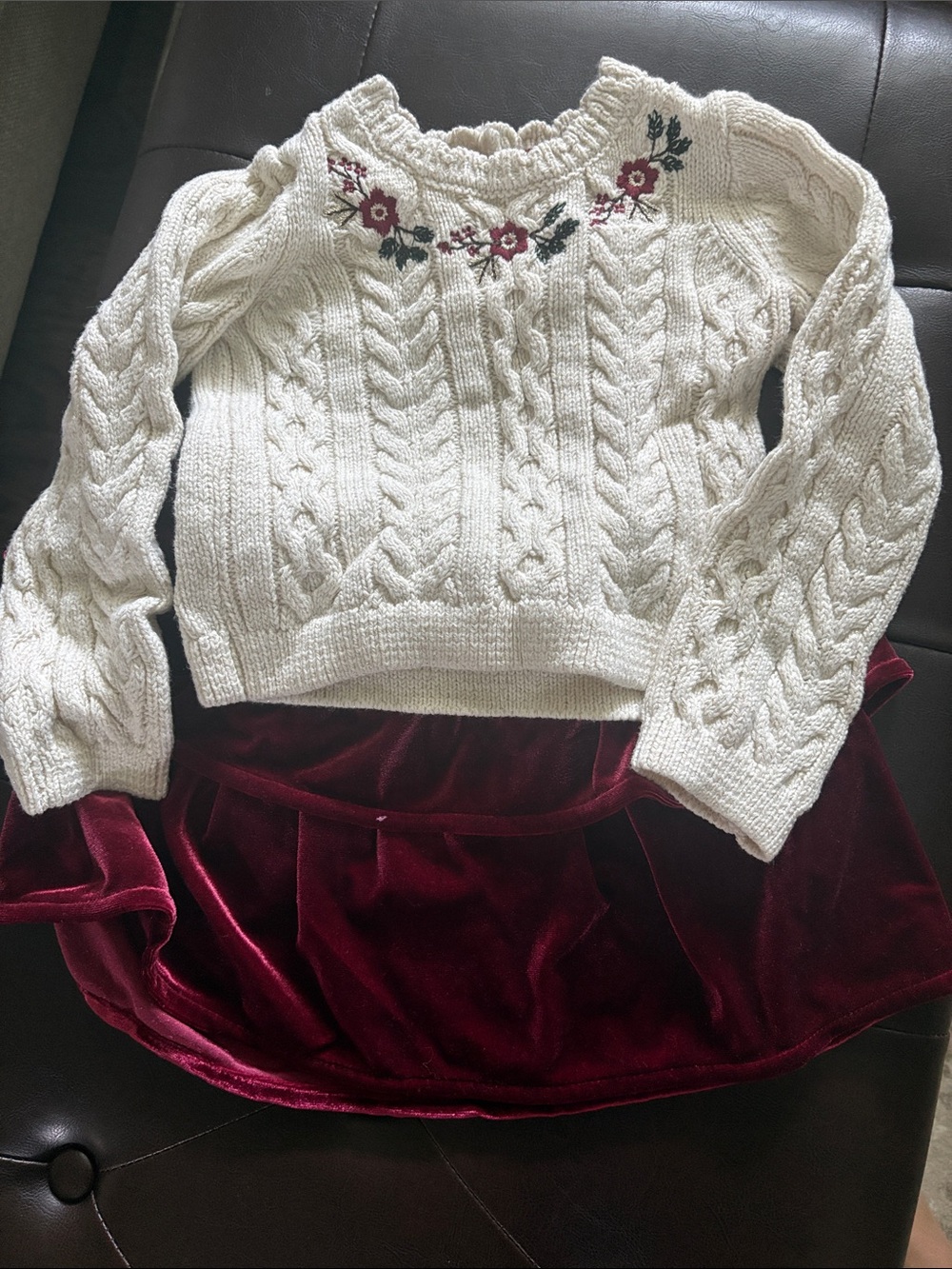 Cream Cable-Knit Sweater with Floral Embroidery and burgundy velvet skirt
